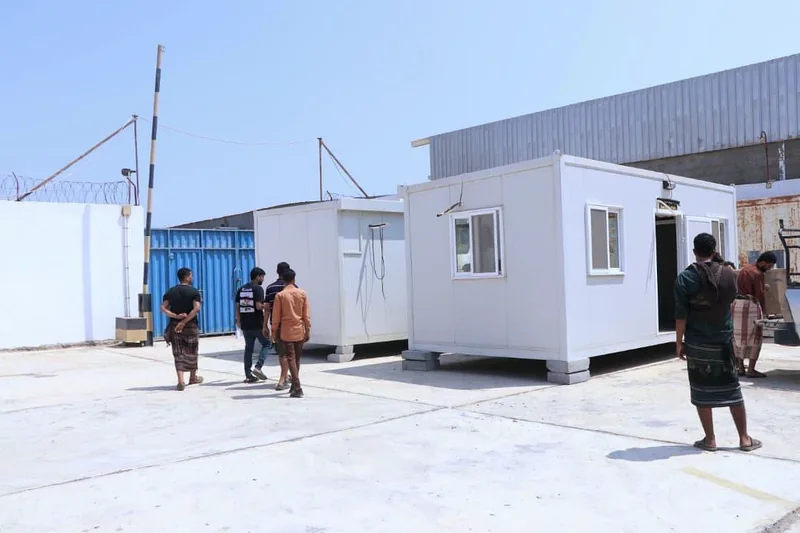 Mobile clinic units positioned on site with several people around them